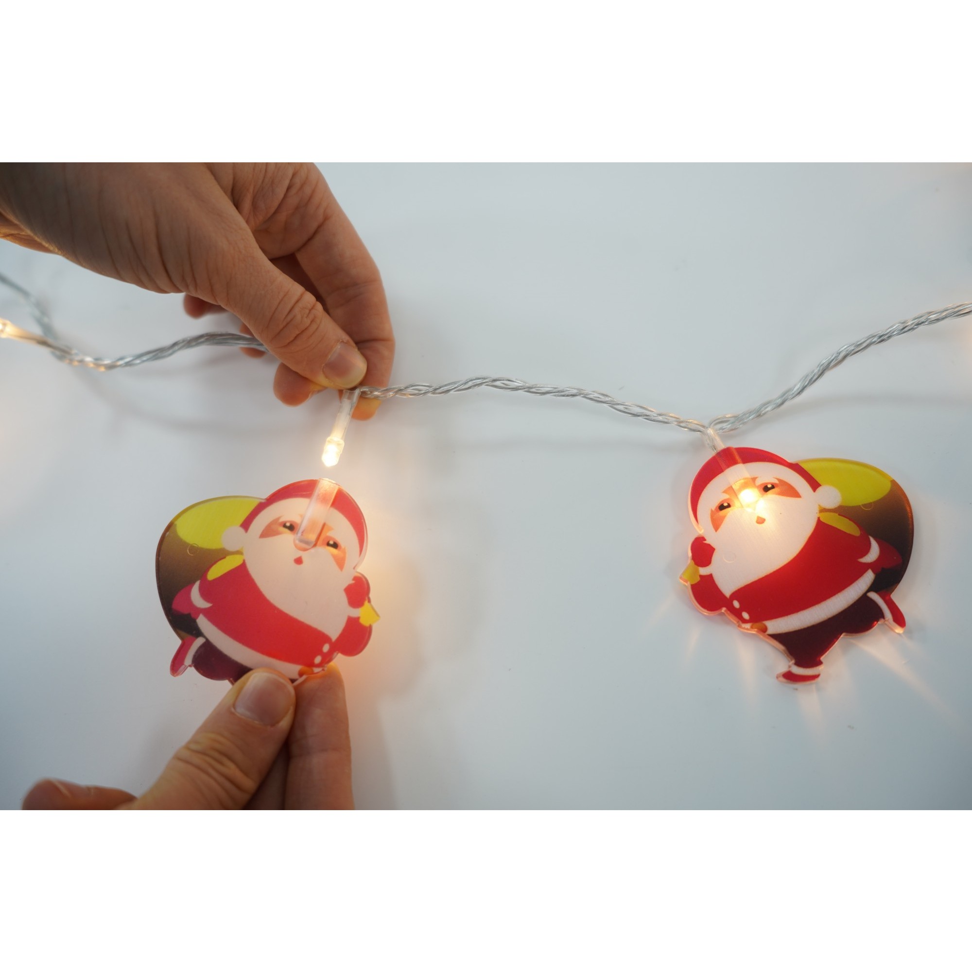 Instalatie Craciun cu ornamente Mos Craciun cu sac, 1 m, 10 LED-uri, Alb Cald, Baterii, Fir Transparent, Flippy