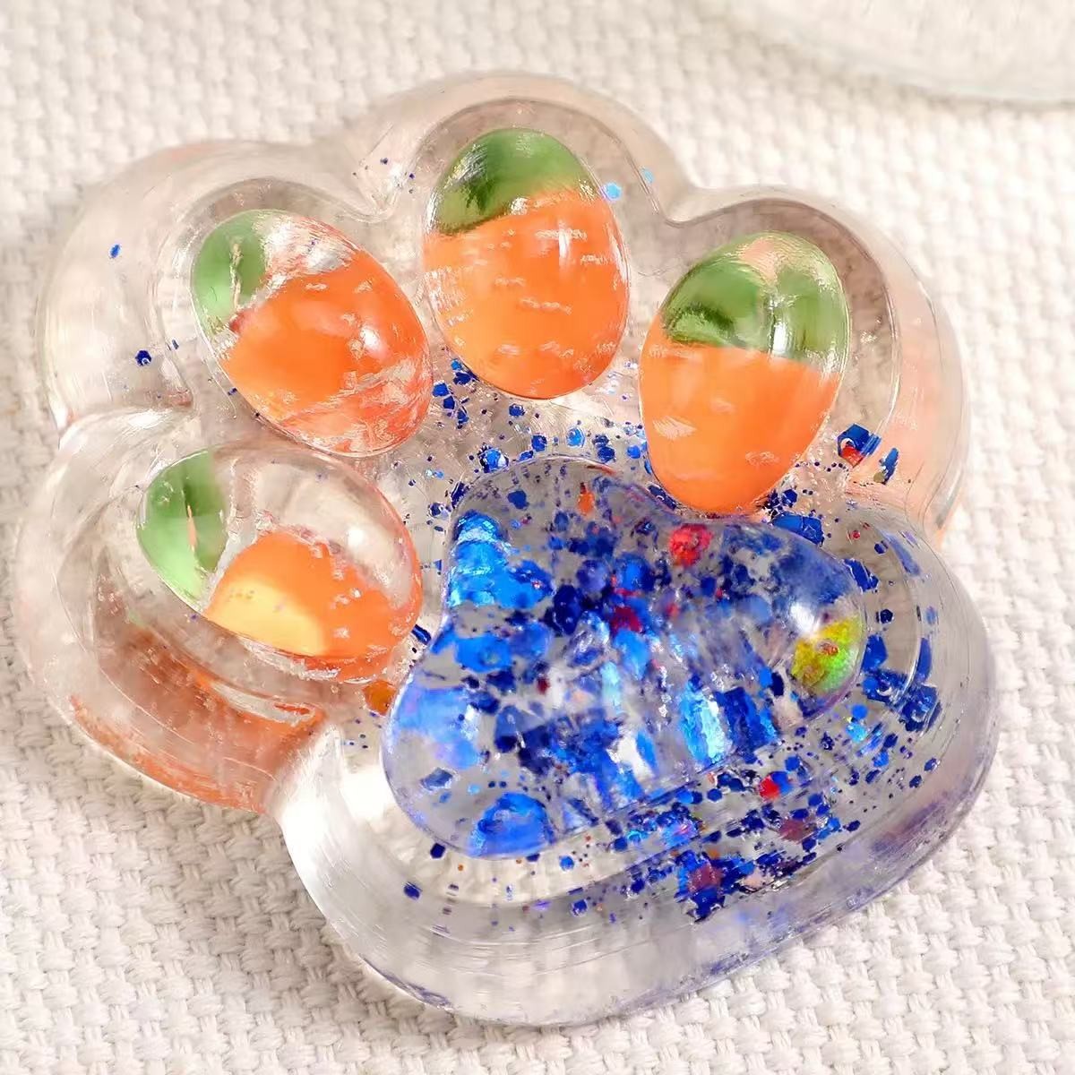 Jucarie Antistres Squishy, Flippy, cu Revenire Lenta, Labuta de Pisica Pufoasa, 7.5 cm, Ambalaj Transparent, Model 270526 Multicolor